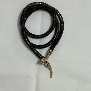 Gold colored with gems snake belt or can be used as a necklace